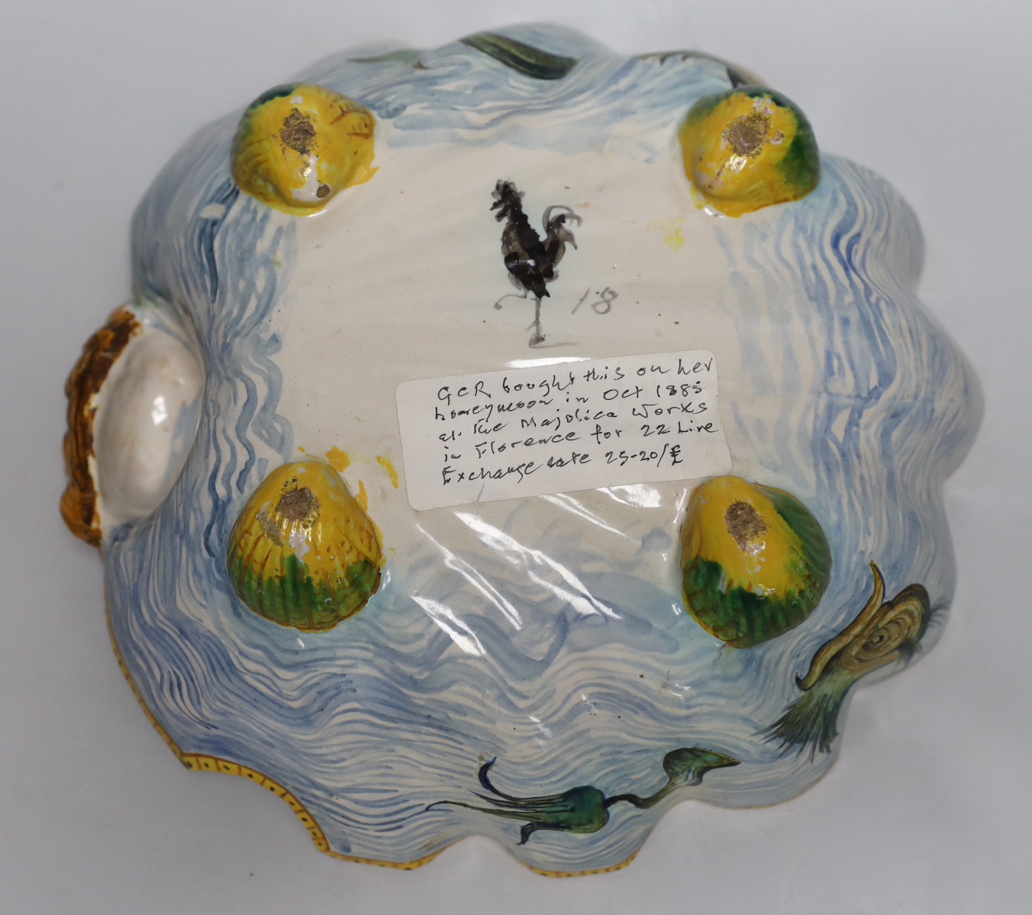 A late 19th/early 20th century Cantagalli maiolica scallop shell shaped dish, painted cockerel mark to base. 29cm long